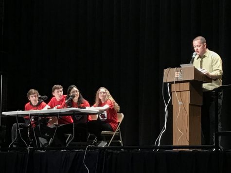 Red team contestants Gavin Morgan, Kieran Plenn, Stephanie Mao and Sarah Shegogue and the moderator Mr. Greedy for junior Red and Black bowl.