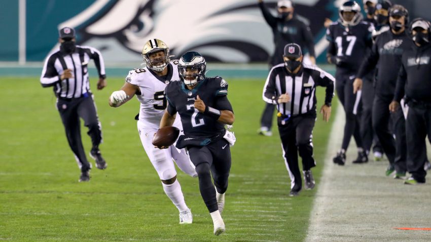 PHILADELPHIA, PENNSYLVANIA - DECEMBER 13: Defensive tackle Shy Tuttle #99 of the New Orleans Saints chases after quarterback Jalen Hurts #2 of the Philadelphia Eagles in the second quarter at Lincoln Financial Field on December 13, 2020 in Philadelphia, Pennsylvania. (Photo by Mitchell Leff/Getty Images)