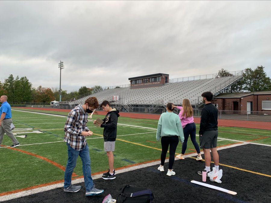 Students in Mr. Gradys first-period Intro to Engineering class fly their planes on the field of Steinly Stadium.