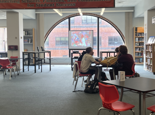 Students gather in the library and enjoy some free popcorn while watching Phillies highlights.