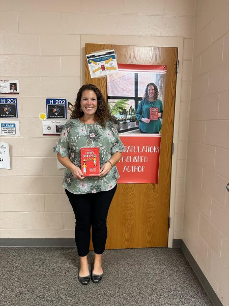 Mrs. Manser holding her new book